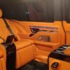 Luxury Van Captain Seats – SSM Chauffeurs UAE Orange leather luxury van seats with center console