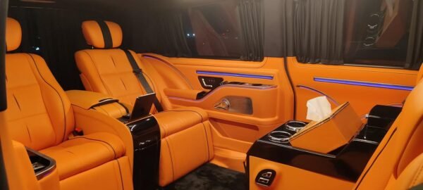 Luxury Van Captain Seats – SSM Chauffeurs UAE Orange leather luxury van seats with center console