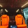 VIP Van Starlight Ceiling – SSM Chauffeurs Luxury VIP van ceiling with red starlight lighting