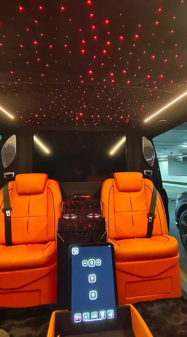VIP Van Starlight Ceiling – SSM Chauffeurs Luxury VIP van ceiling with red starlight lighting