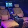 Luxury Van Leather Seats – SSM Chauffeurs Tan leather VIP van seats with entertainment screen