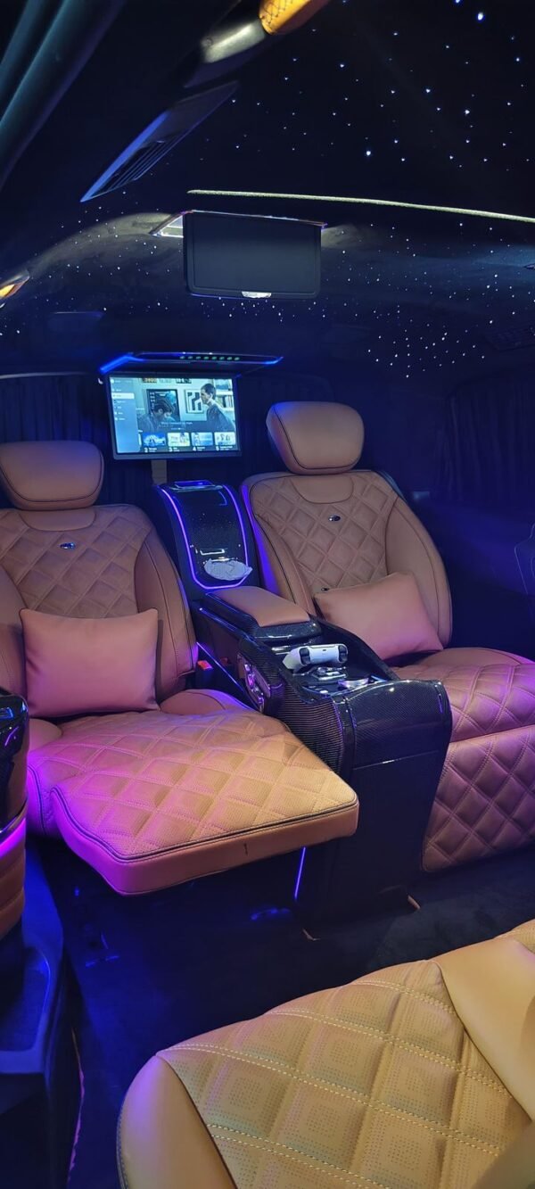 Luxury Van Leather Seats – SSM Chauffeurs Tan leather VIP van seats with entertainment screen