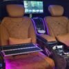 Quilted Leather VIP Van Interior – SSM Chauffeurs Quilted tan leather VIP van seats with center console