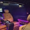 Premium VIP Chauffeur Van Interior – Dubai Luxury VIP van cabin with tan leather seat and ambient lighting