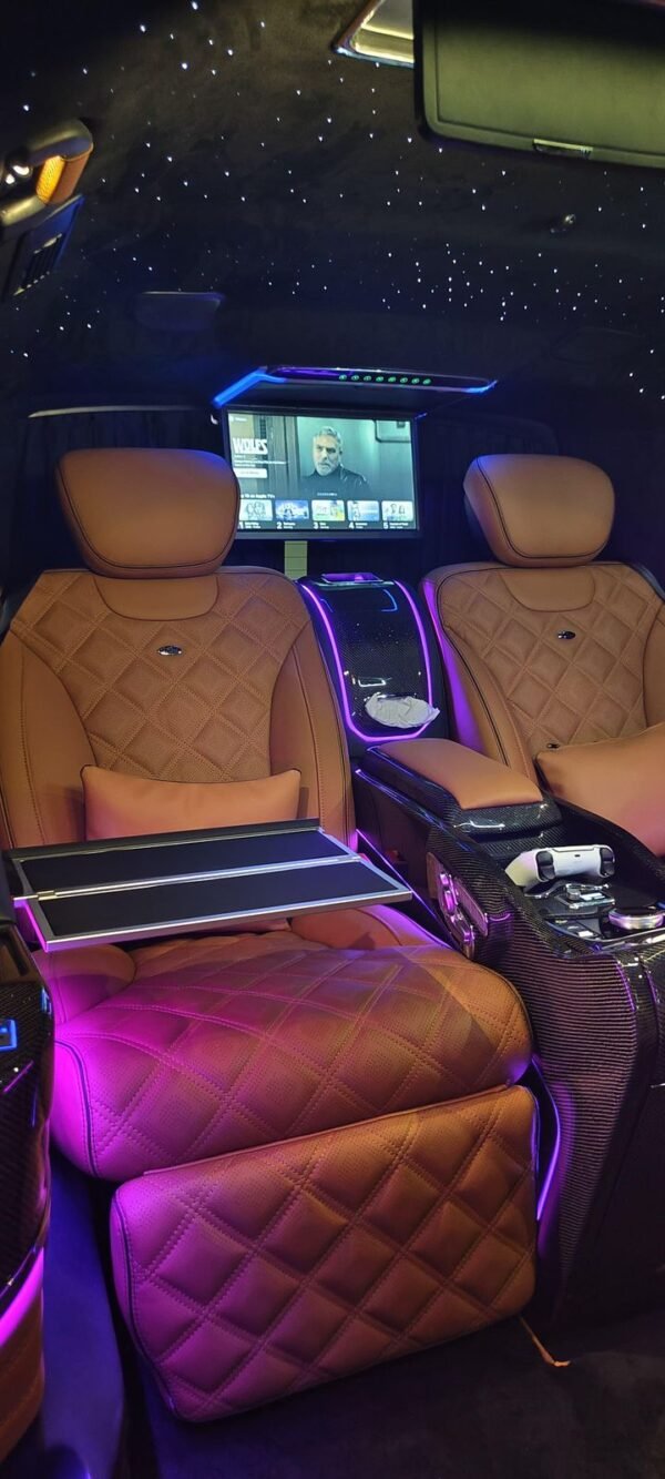Quilted Leather VIP Van Interior – SSM Chauffeurs Quilted tan leather VIP van seats with center console