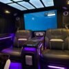 VIP Van Entertainment Cabin – SSM Chauffeurs Luxury VIP van interior with leather seats and large entertainment screen