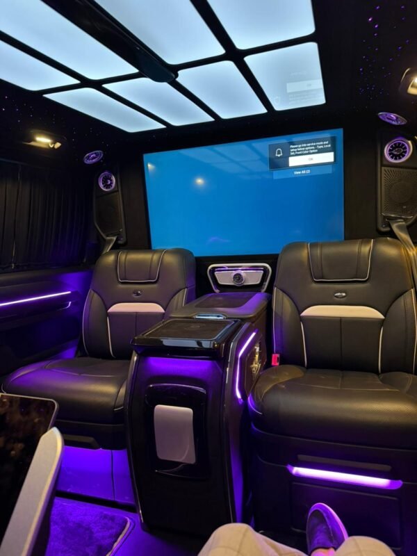 VIP Van Entertainment Cabin – SSM Chauffeurs Luxury VIP van interior with leather seats and large entertainment screen