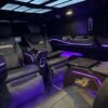 VIP Van Entertainment Interior – SSM Chauffeurs Luxury VIP van entertainment screen and purple ambient lighting