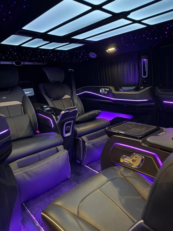 VIP Van Entertainment Interior – SSM Chauffeurs Luxury VIP van entertainment screen and purple ambient lighting