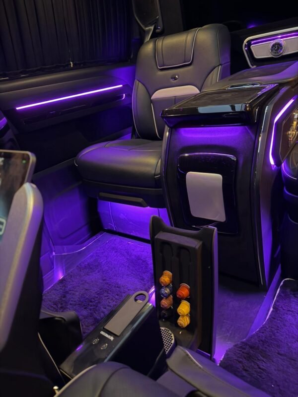 VIP Van Interior with Ambient Lighting – SSM Chauffeurs Luxury VIP van interior with purple ambient lighting and leather seats
