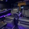 Executive Luxury Van – SSM Chauffeurs UAE Black executive luxury van outside a hotel at night