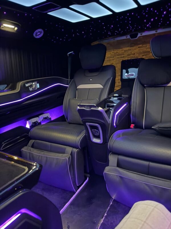 Executive Luxury Van – SSM Chauffeurs UAE Black executive luxury van outside a hotel at night