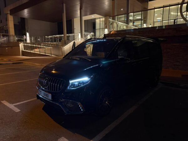 Executive Luxury Van – SSM Chauffeurs UAE Black executive luxury van outside a hotel at night